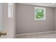Bedroom with a neutral color palette, window providing natural light, and tile flooring at 3222 Bay View Dr, Jonesboro, GA 30236