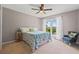 Bright bedroom with a ceiling fan, carpet, and large windows at 3222 Bay View Dr, Jonesboro, GA 30236