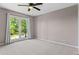 Bedroom with large window and neutral carpet at 3222 Bay View Dr, Jonesboro, GA 30236