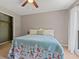 Cozy bedroom features a comfy bed, ceiling fan, and natural lighting at 3222 Bay View Dr, Jonesboro, GA 30236