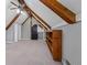 Spacious bonus room features exposed beams, a ceiling fan, and built-in shelving at 3222 Bay View Dr, Jonesboro, GA 30236