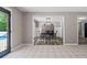 The dining room features hard wood floors and contemporary lighting, with views of the pool visible through the doorway at 3222 Bay View Dr, Jonesboro, GA 30236