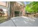 Exterior of home featuring attached garage, brick and stone accents, and paved driveway at 3222 Bay View Dr, Jonesboro, GA 30236