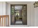 Open foyer with wood floors, leading into a dining area with views of the outdoors at 3222 Bay View Dr, Jonesboro, GA 30236