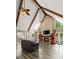 Bright living room with vaulted ceilings, wood beams, a fireplace, and a view of the pool at 3222 Bay View Dr, Jonesboro, GA 30236