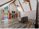 Spacious living room features vaulted ceilings, wood beams, a fireplace, and abundant natural light at 3222 Bay View Dr, Jonesboro, GA 30236