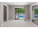 Living room features tile flooring, multiple entrances and views of the pool at 3222 Bay View Dr, Jonesboro, GA 30236