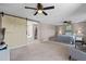 Spacious main bedroom featuring a barn door to bathroom, and ceiling fan at 3222 Bay View Dr, Jonesboro, GA 30236