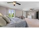 This primary bedroom features a ceiling fan, and access to the backyard area through a glass door at 3222 Bay View Dr, Jonesboro, GA 30236