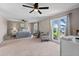 This primary bedroom has two ceiling fans and large windows that provide great lighting and view of the lake at 3222 Bay View Dr, Jonesboro, GA 30236
