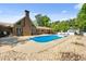 An in-ground pool is situated in the backyard of this lovely brick home, perfect for entertaining at 3222 Bay View Dr, Jonesboro, GA 30236