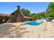Backyard featuring in-ground pool, diving board, patio and ample greenery at 3222 Bay View Dr, Jonesboro, GA 30236