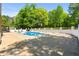 This in-ground pool is surrounded by a privacy fence and features a diving board and a seating area at 3222 Bay View Dr, Jonesboro, GA 30236