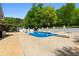 Backyard featuring in-ground swimming pool with diving board and ample patio space at 3222 Bay View Dr, Jonesboro, GA 30236