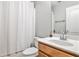 Bathroom with a shower curtain, faucet, vanity and toilet at 334 Pin Oak Ave, Woodstock, GA 30188