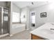 Bathroom with a shower, garden tub, double vanity, and tile floor at 334 Pin Oak Ave, Woodstock, GA 30188