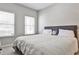 Relaxing bedroom with a comfy bed, soft lighting, and a minimalist design for a peaceful atmosphere at 334 Pin Oak Ave, Woodstock, GA 30188