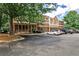 View of a two-story brick building with large windows and a parking lot at 334 Pin Oak Ave, Woodstock, GA 30188