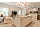Living room providing access to the kitchen, comfortable furniture, and natural light at 334 Pin Oak Ave, Woodstock, GA 30188