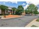 Well-maintained parking lot area with trees and landscaping provides ample parking at 334 Pin Oak Ave, Woodstock, GA 30188