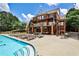 A luxurious community pool and deck area offer a perfect space for relaxation and recreation at 334 Pin Oak Ave, Woodstock, GA 30188