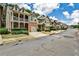 A street of suburban homes with well-manicured front yards and driveways in a residential neighborhood at 334 Pin Oak Ave, Woodstock, GA 30188