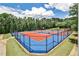 Community tennis courts with outdoor lighting and greenery, ideal for active residents at 334 Pin Oak Ave, Woodstock, GA 30188