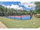 Outdoor tennis courts with lights provides residents with an active lifestyle at 334 Pin Oak Ave, Woodstock, GA 30188