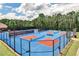 Well-maintained tennis courts offer residents a great recreational amenity at 334 Pin Oak Ave, Woodstock, GA 30188
