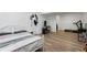 Finished basement with bedroom setup including laminate flooring and workout equipment at 3512 Lynview W Ct, Decatur, GA 30034