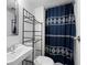 Bathroom featuring a shower with dark blue shower curtain, a toilet, and a vanity at 3512 Lynview W Ct, Decatur, GA 30034
