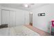 Bright bedroom with a ceiling fan, light-colored walls and carpet, and a closet for storage at 3512 Lynview W Ct, Decatur, GA 30034