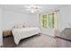 Well-lit bedroom featuring large window, neutral colors, ceiling fan, and dresser at 3512 Lynview W Ct, Decatur, GA 30034