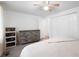 Spacious bedroom with a ceiling fan, closet, dresser, and light colored carpet at 3512 Lynview W Ct, Decatur, GA 30034
