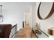 Hallway featuring hardwood floors and a designer mirror with hallway lighting at 3512 Lynview W Ct, Decatur, GA 30034