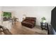Open living area with hardwood floors connecting to an outdoor patio with seating at 3512 Lynview W Ct, Decatur, GA 30034