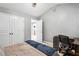 Bright bedroom featuring neutral walls, double closets, and a desk workspace area at 4092 Grand Park Dr, Suwanee, GA 30024