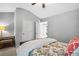 Spacious bedroom with a wood-frame bed, carpet, and two visible entryways to other rooms at 4092 Grand Park Dr, Suwanee, GA 30024