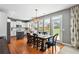 Charming dining area with hardwood floors, large windows, and modern lighting fixture at 4092 Grand Park Dr, Suwanee, GA 30024