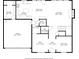 Detailed floor plan showcasing layout of the first floor, with kitchen, living room, and garage at 4092 Grand Park Dr, Suwanee, GA 30024