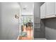 Hallway showcasing hardwood floors and view into the dining and kitchen areas at 4092 Grand Park Dr, Suwanee, GA 30024