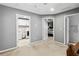 Hallway leading to laundry room and bedroom with carpet floors and gray walls at 4092 Grand Park Dr, Suwanee, GA 30024