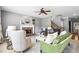 Comfortable living room with fireplace, neutral decor, large windows, and a staircase, perfect for entertaining at 4092 Grand Park Dr, Suwanee, GA 30024