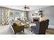Inviting living room with a fireplace, large windows, and comfortable seating, perfect for relaxation at 4092 Grand Park Dr, Suwanee, GA 30024