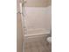 Clean bathroom with tub/shower combo and tile flooring at 4605 Fourth Rail Ln, Cumming, GA 30040