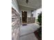 View of the covered front porch with stone accents at 4605 Fourth Rail Ln, Cumming, GA 30040