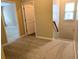 A carpeted hallway leading to other rooms in the home at 4605 Fourth Rail Ln, Cumming, GA 30040