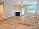 Bright and airy living room featuring hardwood floors, fireplace and access to the backyard at 4605 Fourth Rail Ln, Cumming, GA 30040