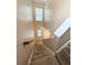 A carpeted staircase leading to the upper level of the home at 4605 Fourth Rail Ln, Cumming, GA 30040