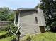 Home exterior featuring gray siding and an attached wooden deck accessible from the side at 554 Oak Landing Cir, Douglasville, GA 30134
